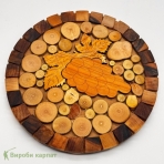 Coaster made of natural wood slices with a grapevine engraving